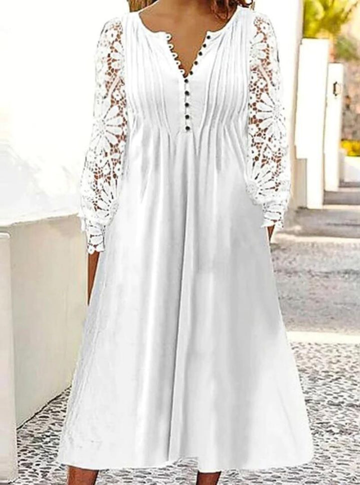 Ladies' knee-length A-line summer dress with crocheted long sleeves, pleated bodice and decorative button placket Mune Fashion