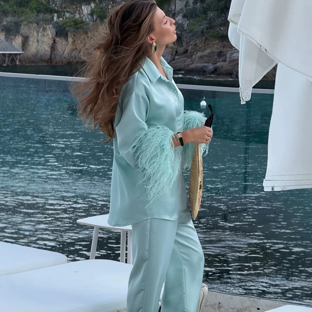 Ladies two-piece satin set with feather trim at the cuffs Mune Fashion