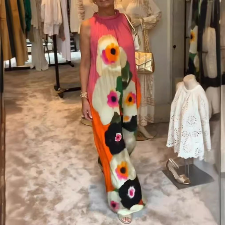 Women's sleeveless maxi dress with ruffled high collar, wide palazzo cut, and large floral print Mune Fashion