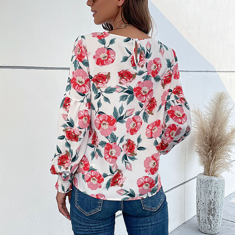 Ladies lightweight blouse with large floral print, volume sleeves and smocked cuffs Mune Fashion