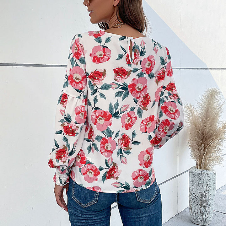 Ladies lightweight blouse with large floral print, volume sleeves and smocked cuffs Mune Fashion