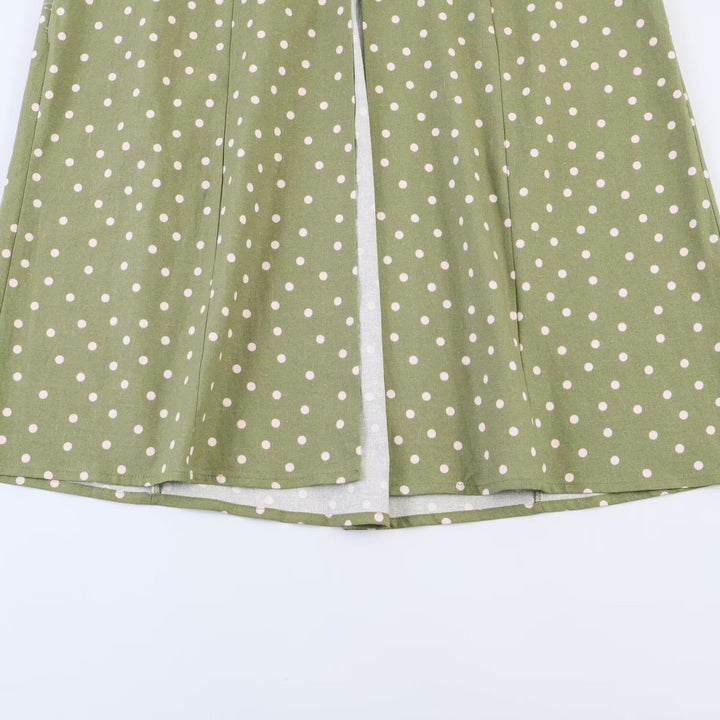 Women's vintage-inspired strap midi dress with tailored fit and continuous button placket Mune Fashion