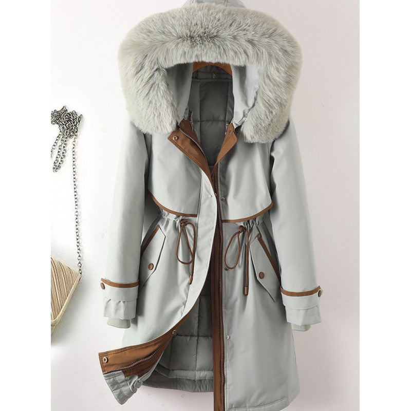 Women's long parka with faux fur hood, waist drawstring, and contrasting piping Mune Fashion