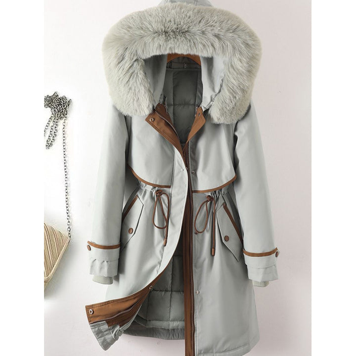 Women's long parka with faux fur hood, waist drawstring, and contrasting piping Mune Fashion