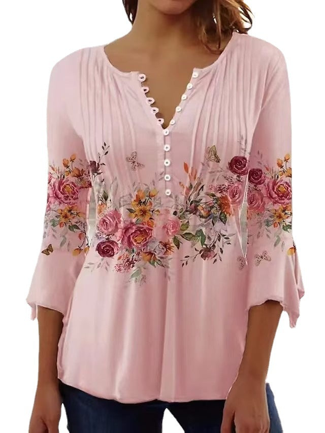 Ladies airy tunic blouse with watercolor floral border, knife pleats, and three-quarter sleeves Mune Fashion