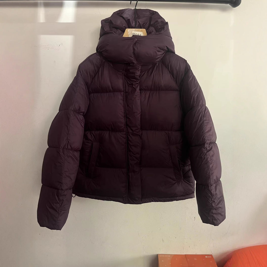 Women's short cut oversized quilted jacket with high collar and hood Mune Fashion