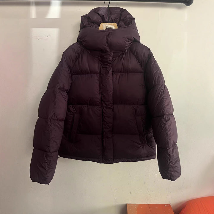 Women's short cut oversized quilted jacket with high collar and hood Mune Fashion