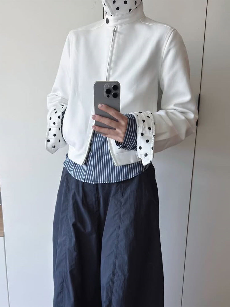 Women’s short-cut blouson jacket with stand-up collar, concealed zipper and contrasting polka dot patterned lining Mune Fashion