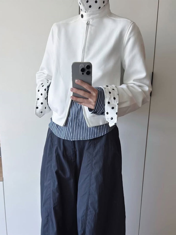 Women’s short-cut blouson jacket with stand-up collar, concealed zipper and contrasting polka dot patterned lining Mune Fashion