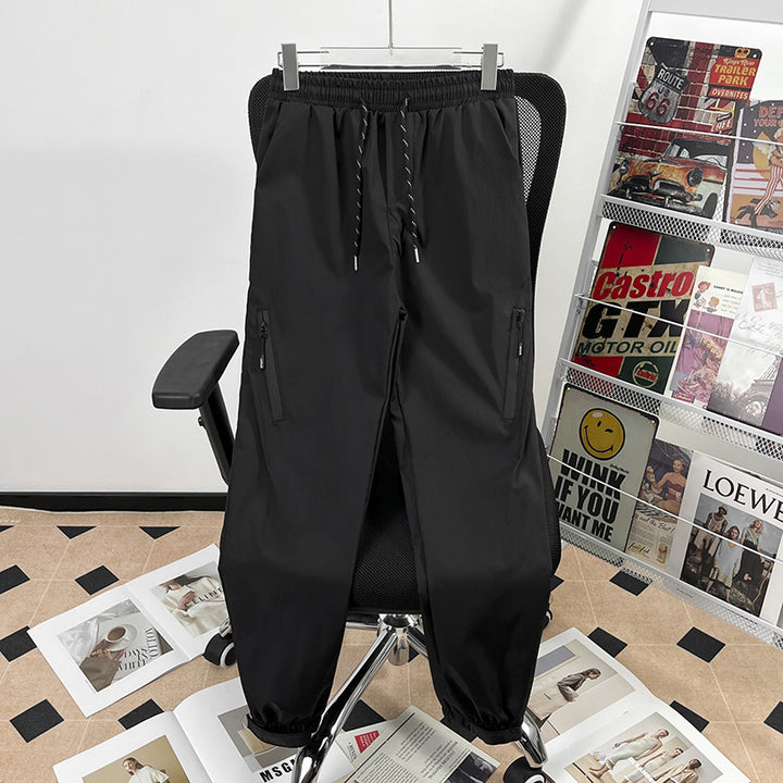 Unisex sporty jogging pants with adjustable waistband and side pockets Mune Fashion
