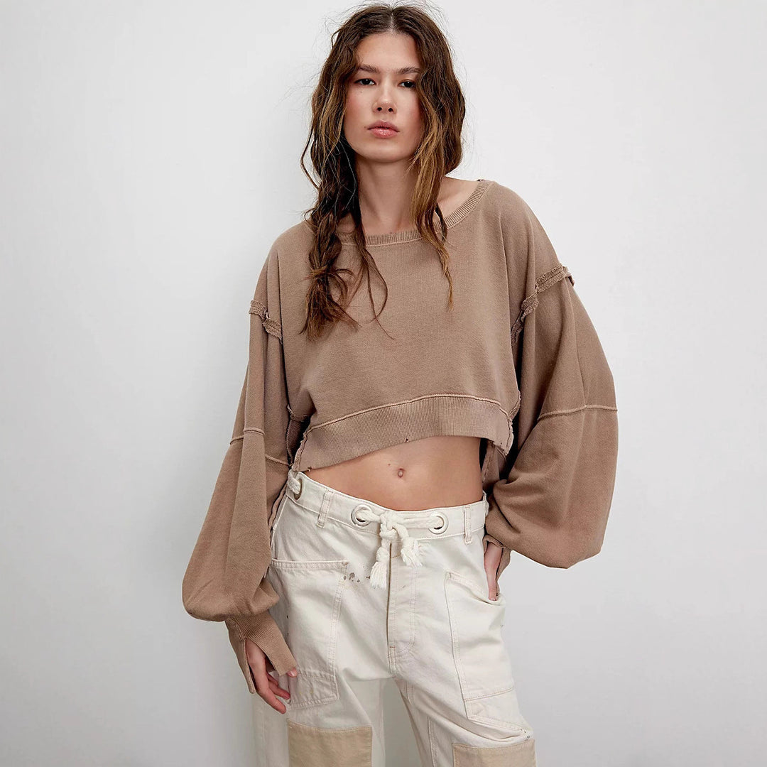 Women's cropped oversized sweatshirt with thumb hole, frayed hem, and wide raglan sleeves Mune Fashion