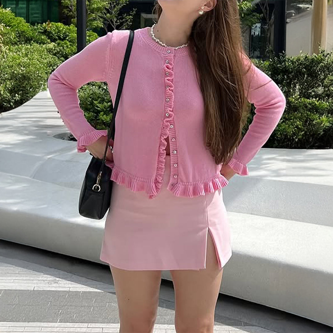 Women’s short cut knit cardigan with ruffled button placket and gathered cuffs Mune Fashion