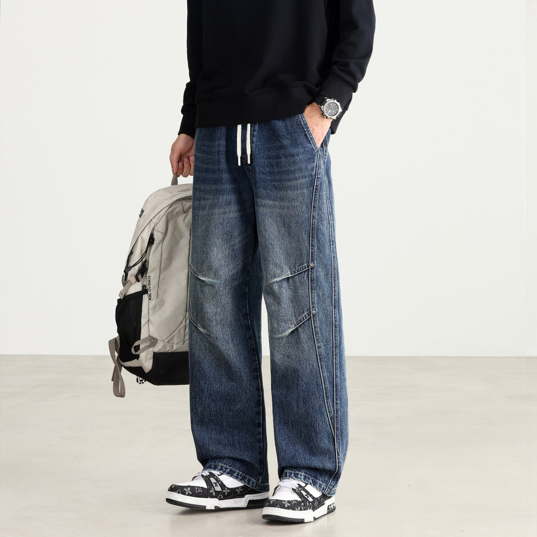 Men's Loose Fit Denim Pants with Drawstring Waistband, Panel Seams and Used Wash Mune Fashion