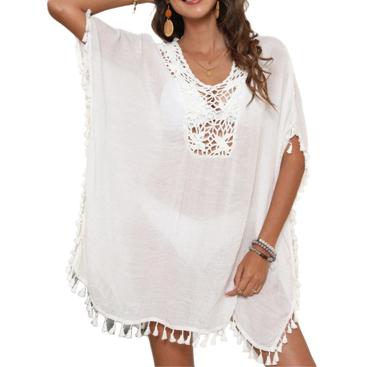 Ladies airy beach poncho with crocheted neckline and playful fringes Mune Fashion