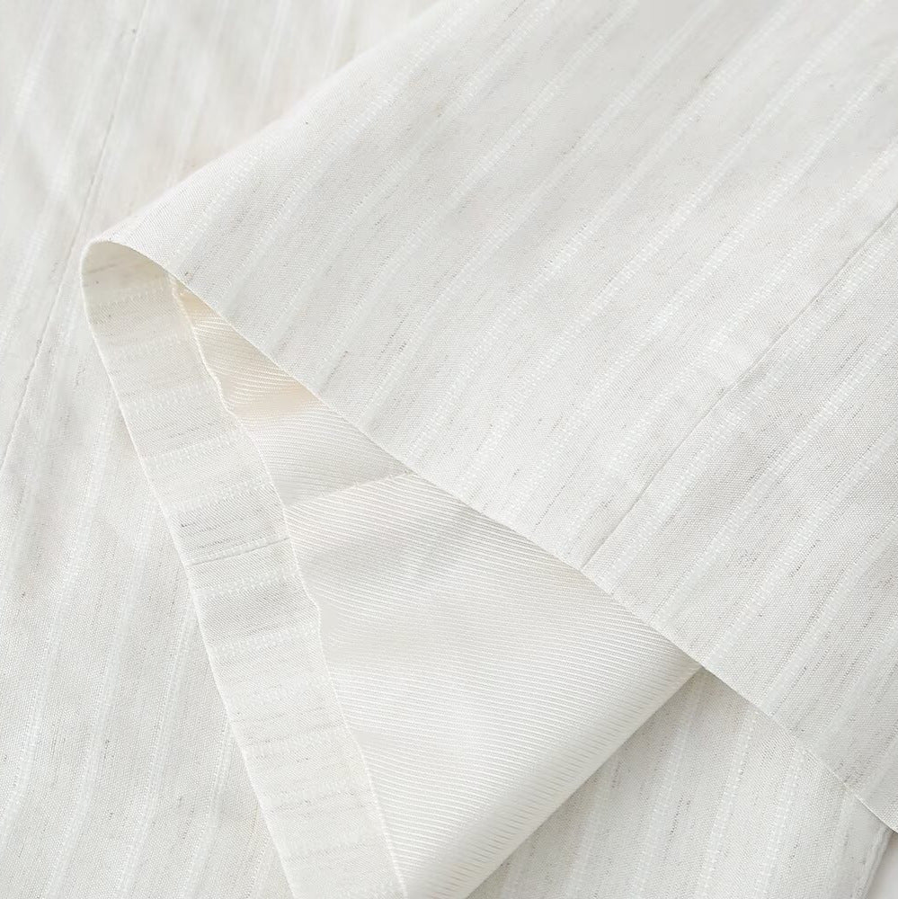Women's linen look long blazer with wide lapels, roll-up sleeves, and flap pockets Mune Fashion