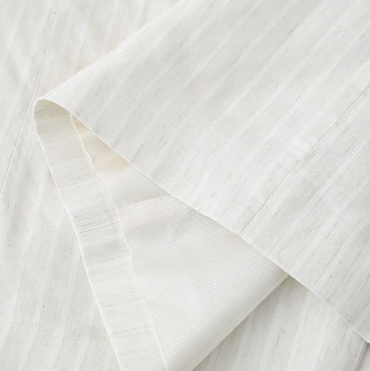 Women's linen look long blazer with wide lapels, roll-up sleeves, and flap pockets Mune Fashion