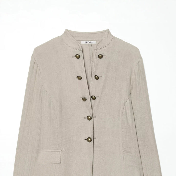 Women's short blazer with stand-up collar, decorative button placket, and rounded hem Mune Fashion