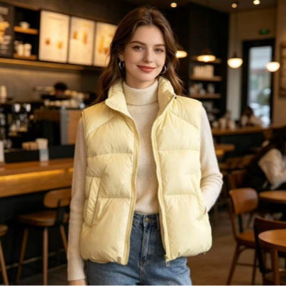Women's short padded puffer jacket with high stand-up collar and practical side pockets Mune Fashion