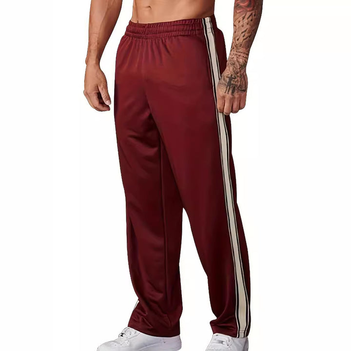 Men's sporty training pants with side tape stripes and elastic waistband Mune Fashion