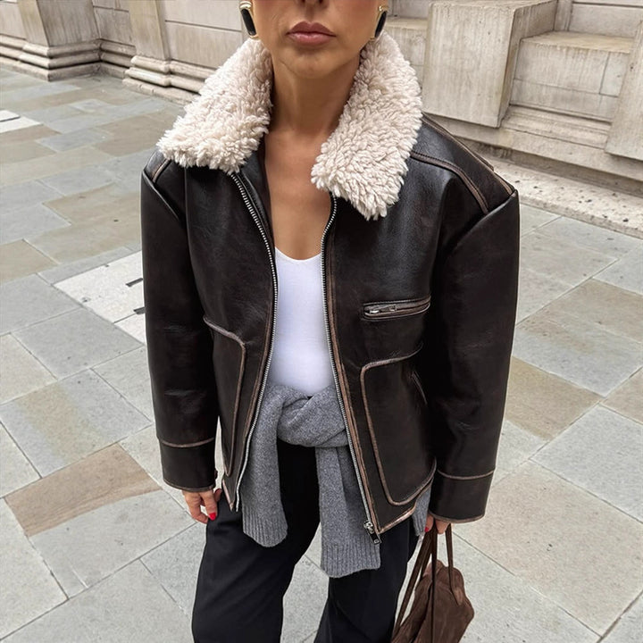 Women Short Cut Leather Imitation Bomber Jacket with Voluminous Teddy Shawl Collar and Distinctive Decorative Seams Mune Fashion