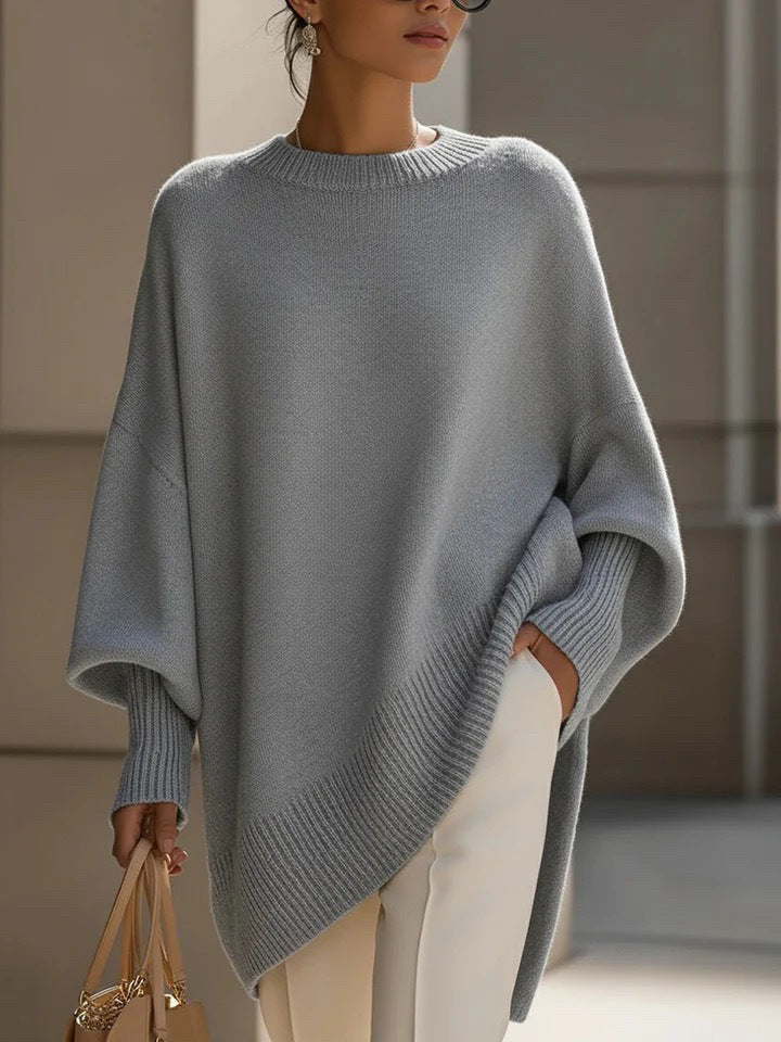 Women's oversized knit poncho with asymmetrical hem and ribbed sleeves Mune Fashion