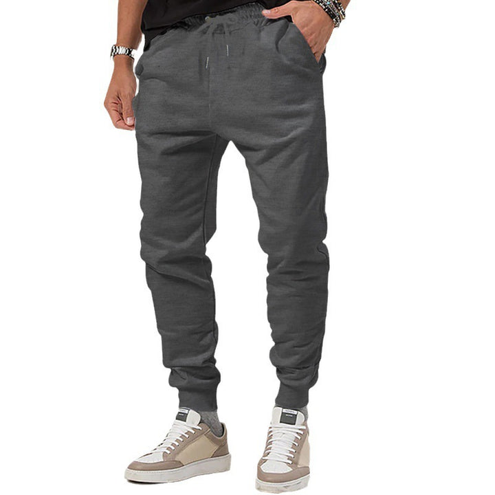 Men's jersey sweatpants in a tapered cut with concealed drawstring and shape-stable ankle cuffs Mune Fashion