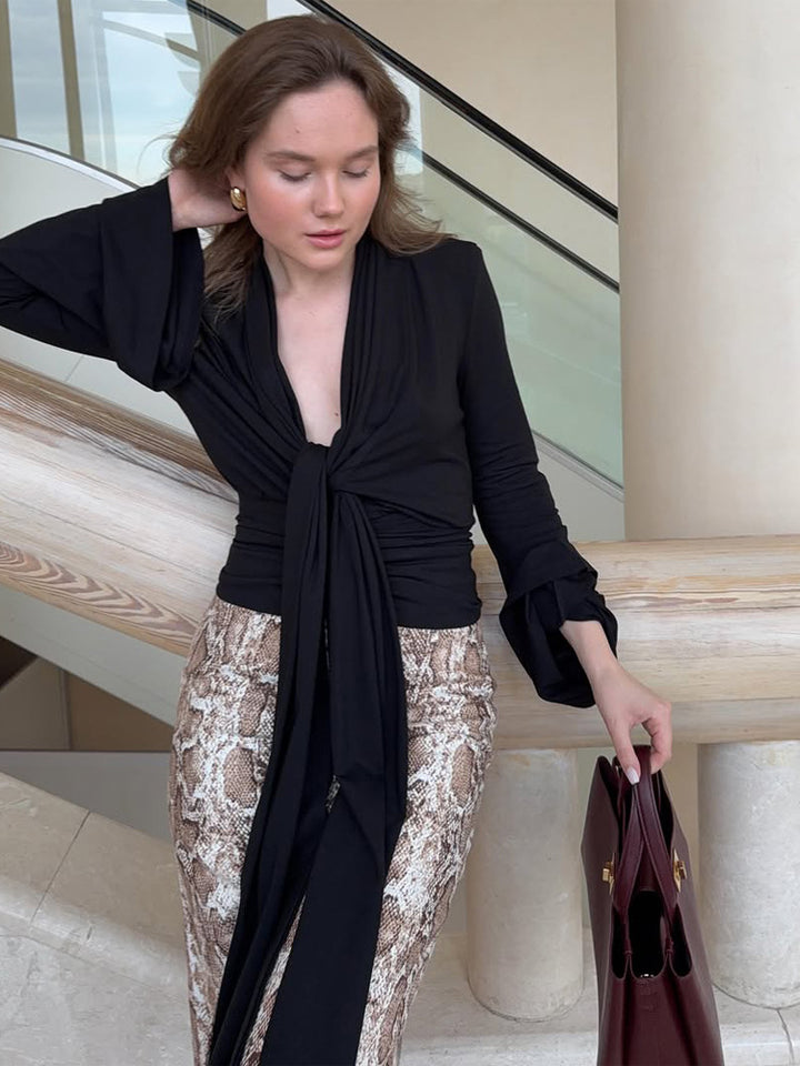Women's wrap blouse with deep V-neck, long tie ribbons and ruffle sleeves Mune Fashion