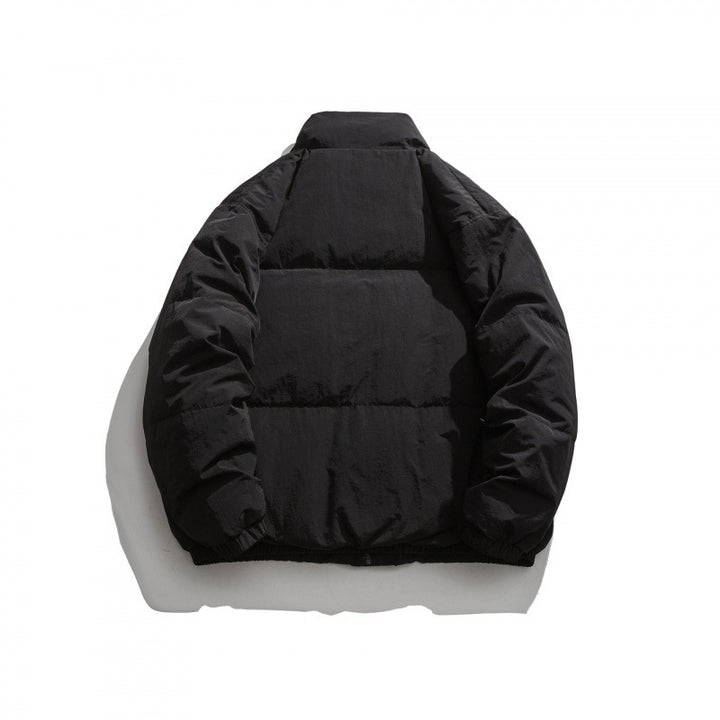 Unisex Oversized padded quilted jacket with high stand collar, large flap pockets and crinkle effect Mune Fashion