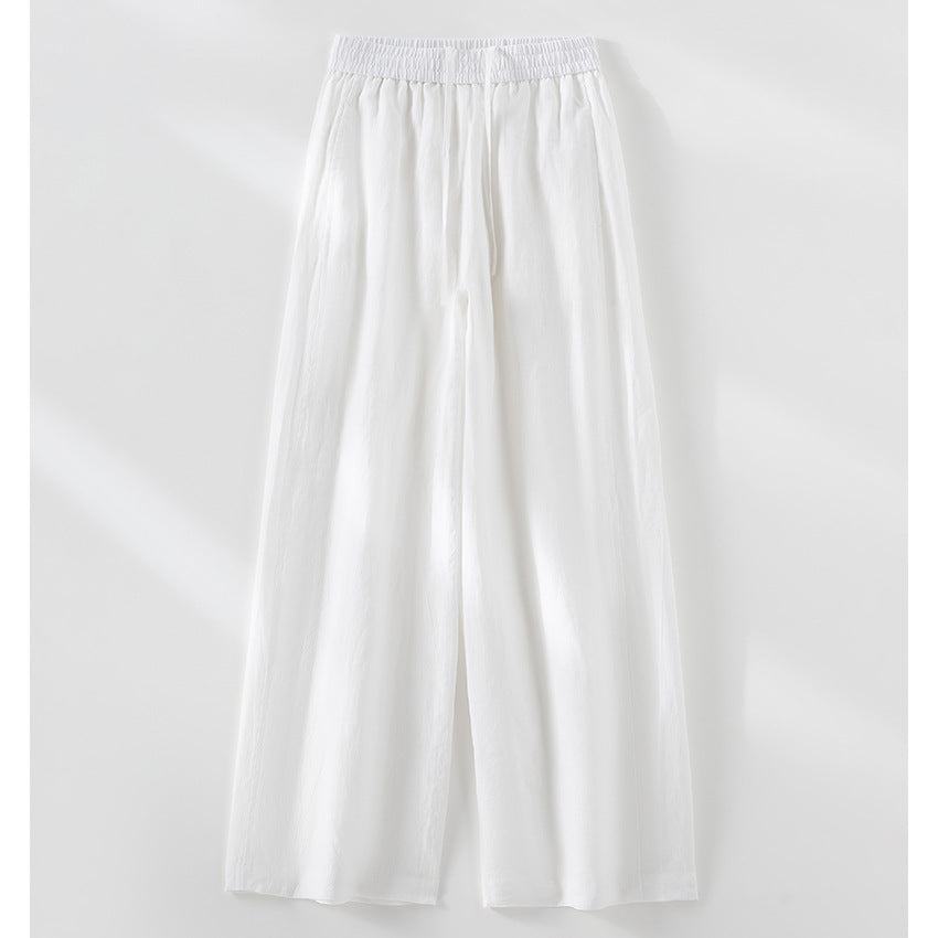 Women's wide linen look trousers with high elastic waistband and flowing wide leg silhouette Mune Fashion