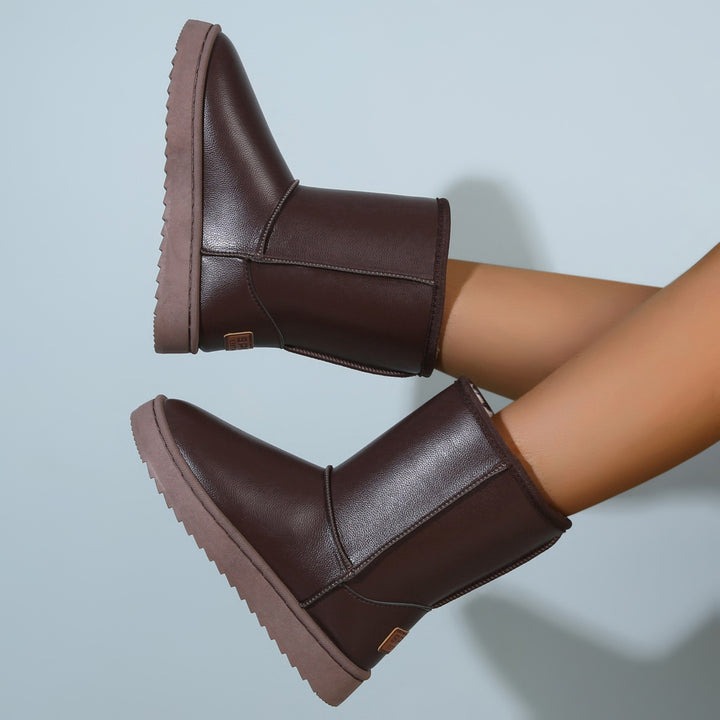 Women's winter boots with teddy lining, leather look and flat platform sole Mune Fashion