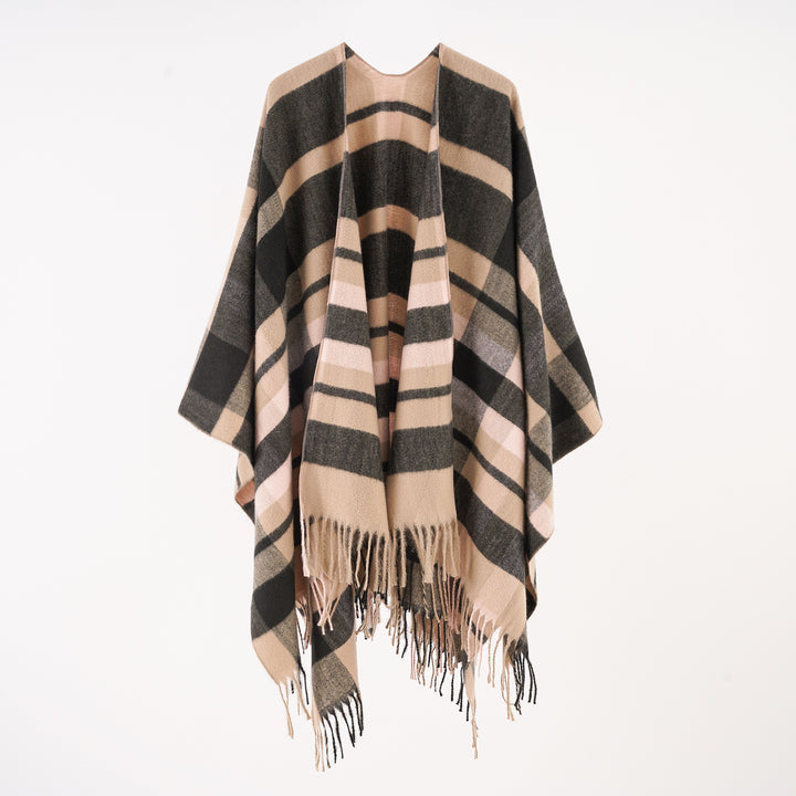 Women's wool blend ruana in boxy oversized with large check pattern and fringed hem.