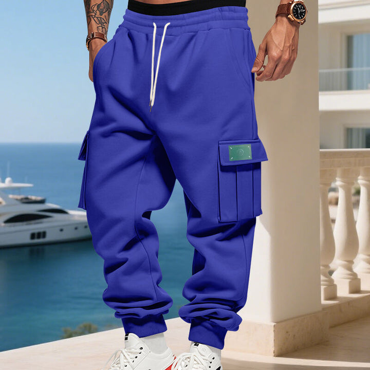 Men's Cargo Jogging Pants with generous flap pockets, elastic waistband, and ribbed hem Mune Fashion