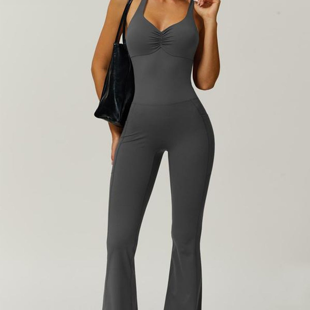 Women's sporty jumpsuit with figure-hugging cut and straps Mune Fashion