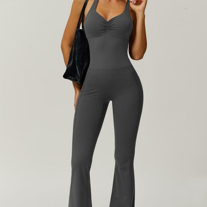 Women's sporty jumpsuit with figure-hugging cut and straps Mune Fashion