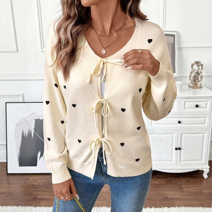 Women's fine knit cardigan with decorative bow closures and heart motif Mune Fashion
