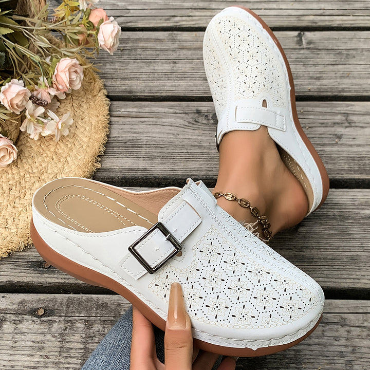 Women's comfort mule with adjustable buckled strap and ornamental hole embossing Mune Fashion