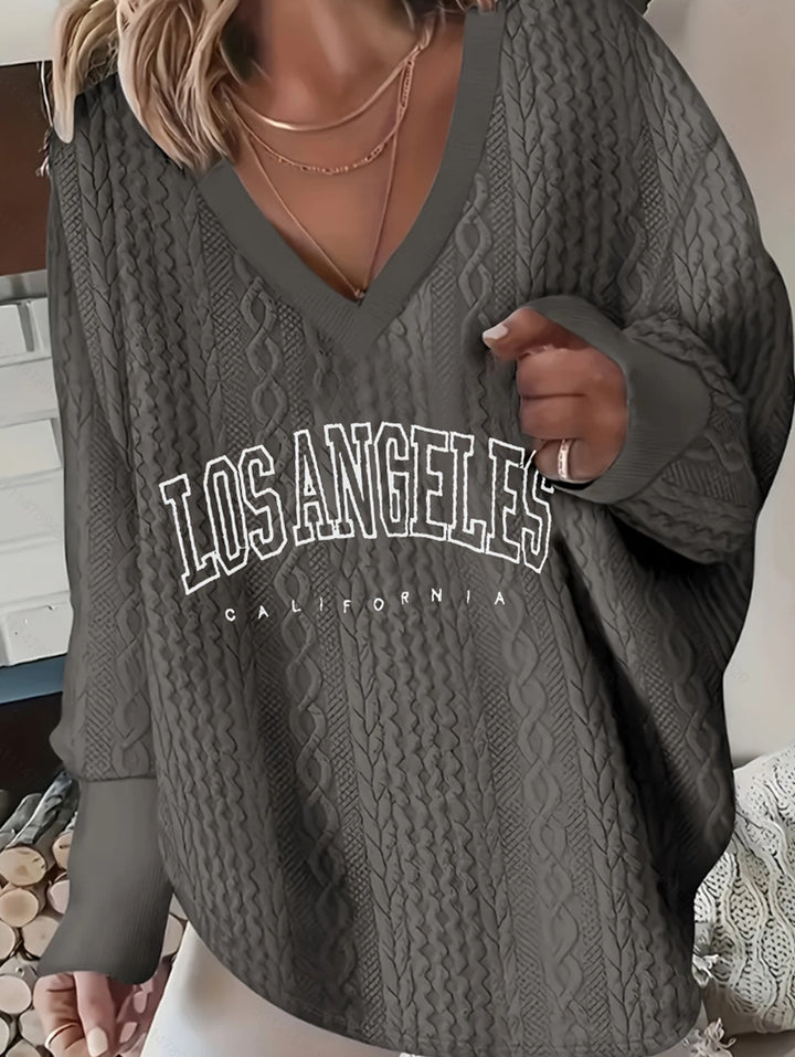 Women's oversized cable knit sweater with V-neck and logo print Mune Fashion