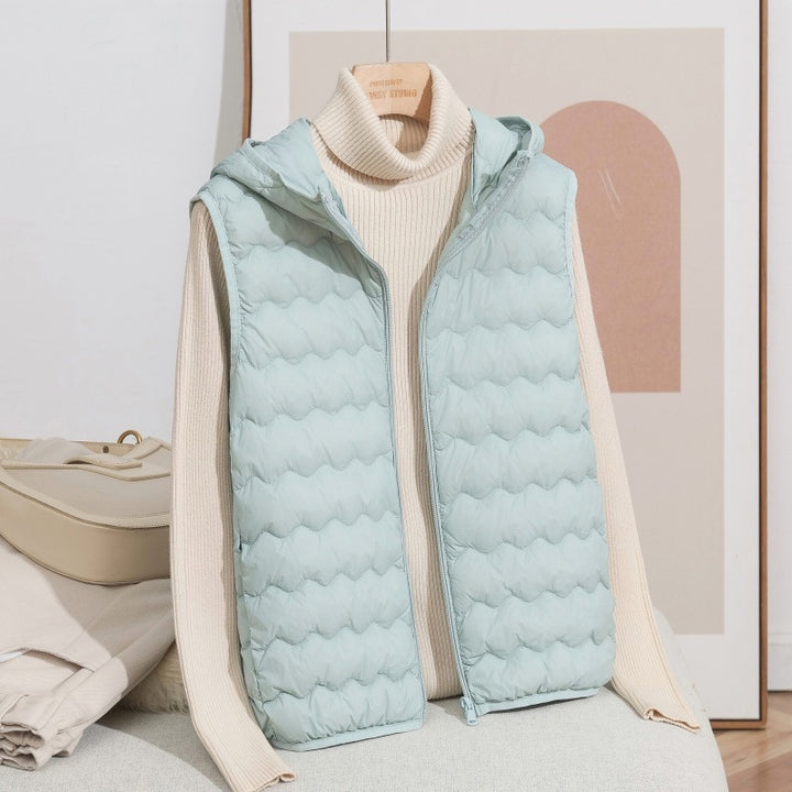 Women Ultra-light Hooded Quilted Vest with Ergonomic Wave Quilting and Compact Packing Format Mune Fashion