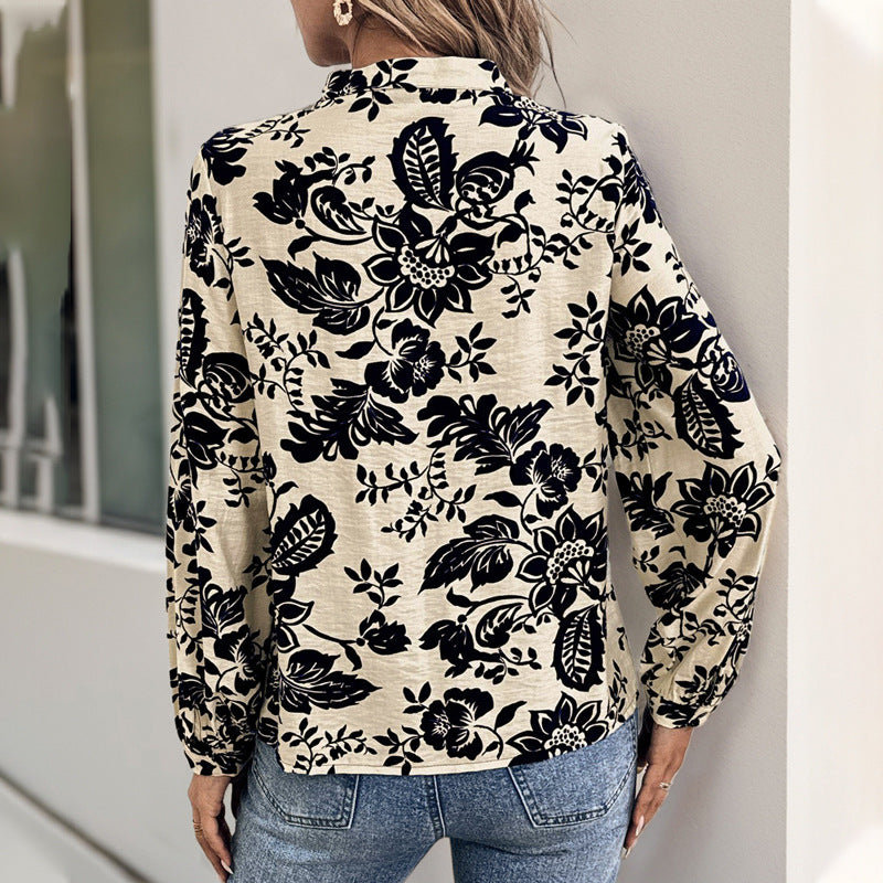 Women's loose-fitting blouse with stand-up collar, box pleats, and floral print Mune Fashion