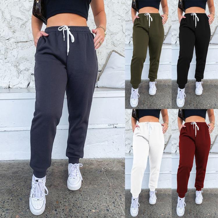 Women's tapered jogging pants at ankle height with elastic comfort waistband, adjustable drawstring, and deep side pockets Mune Fashion