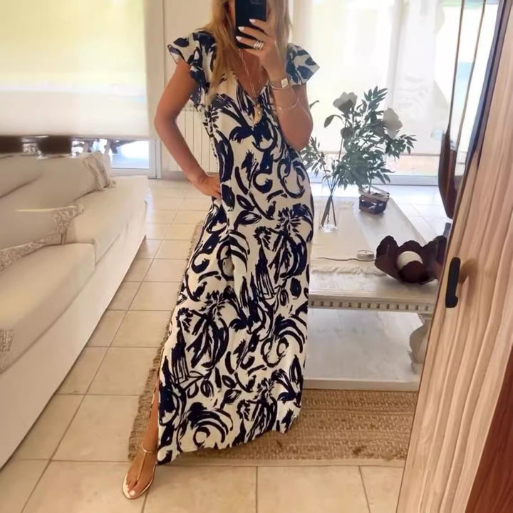 Women's flowing maxi dress with V-neck, flutter sleeves, and side leg slit Mune Fashion