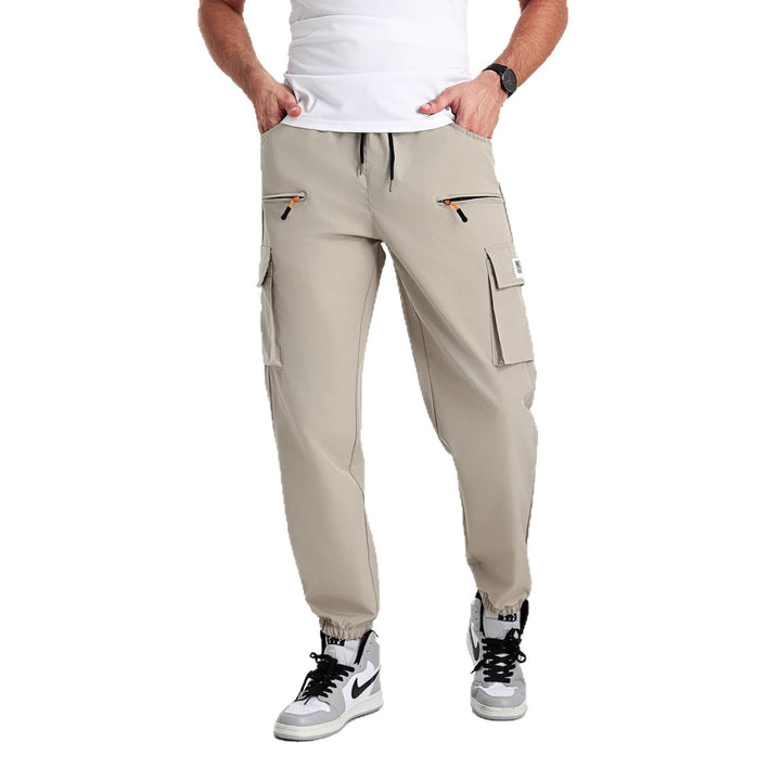 Men's tapered cut utility cargo pants in jogger style with drawstring waistband, zippered pockets & elastic leg cuffs Mune Fashion