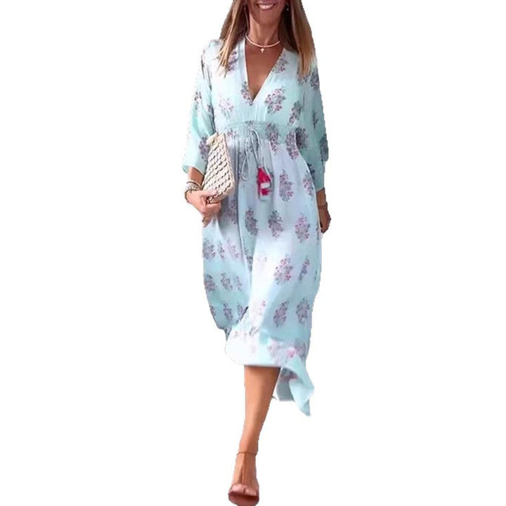 Women’s airy-flowing Boho midi dress with V-neck, gathered smock waist, drawstring with tassels, and asymmetrical ruffled hem Mune Fashion