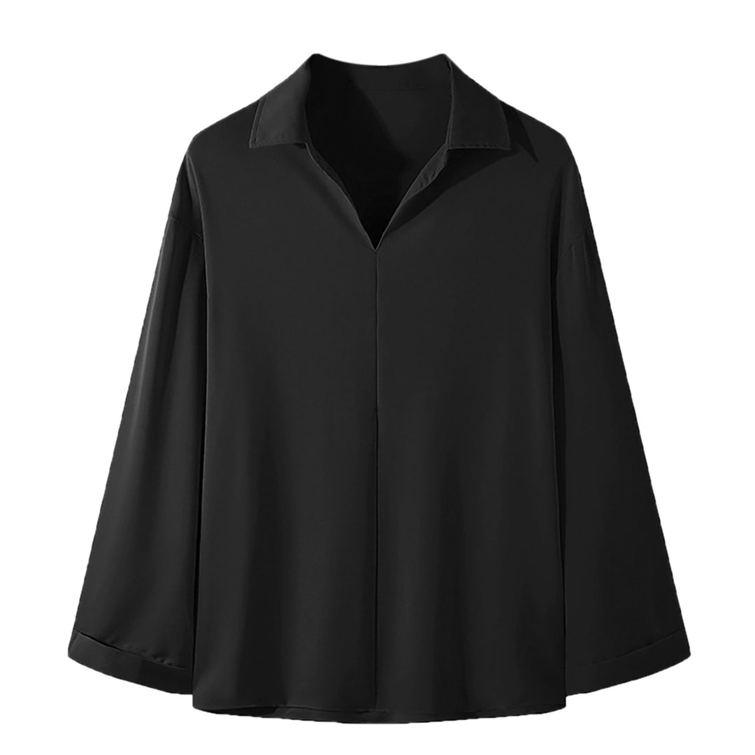 Women's loosely cut tunic blouse with deep V-neck, concealed button placket, and dropped shoulders Mune Fashion