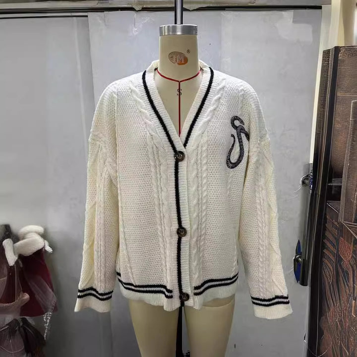 Ladies knitted college cardigan with cable pattern, V-neck, contrast stripes and embroidered appliqués Mune Fashion