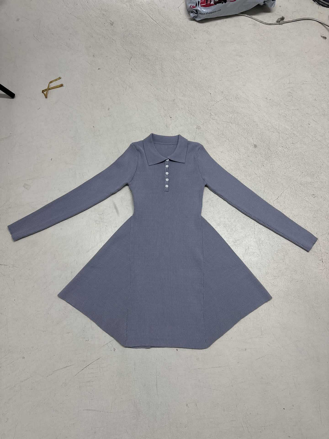 Ladies knitted polo dress with tailored bodice and flared ruffled skirt Mune Fashion