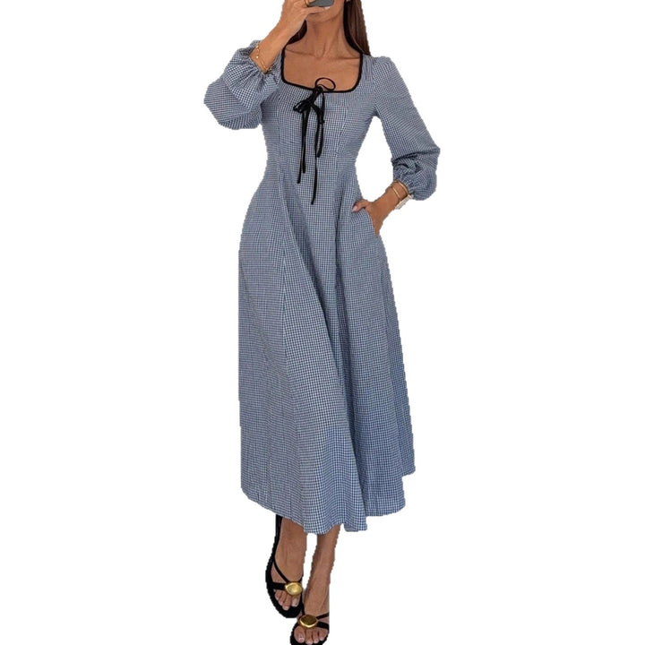 Ladies maxi dress with gingham check, square neckline, waist gathering and balloon sleeves Mune Fashion
