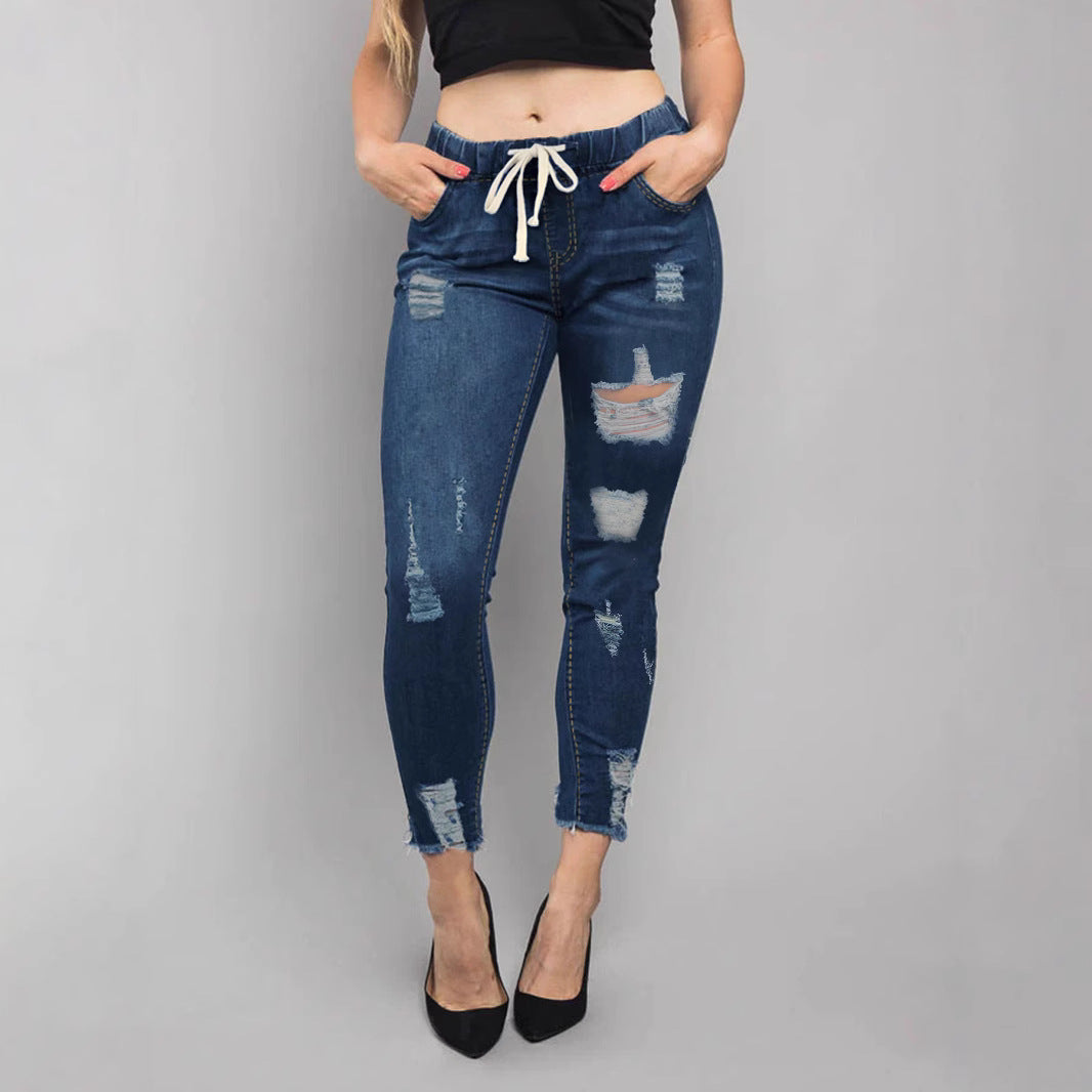 Women High-Waisted Destroyed Jogger Jeans with Elastic Drawstring Waistband and Cropped Frayed Hem Mune Fashion