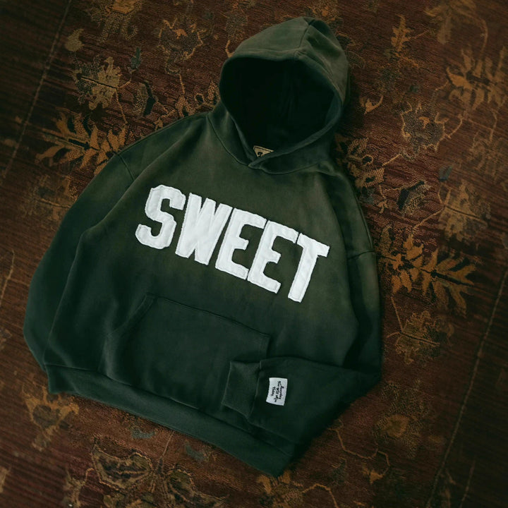 Unisex nan oversized hoodie with appliquéd letter patches and kangaroo pocket Mune Fashion