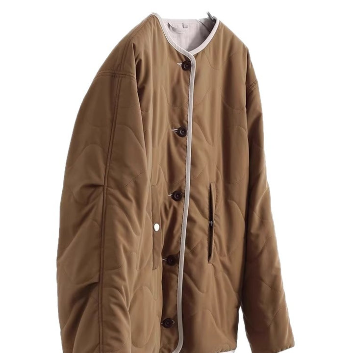 Women's quilted jacket without collar with oversized silhouette and contrast piping Mune Fashion